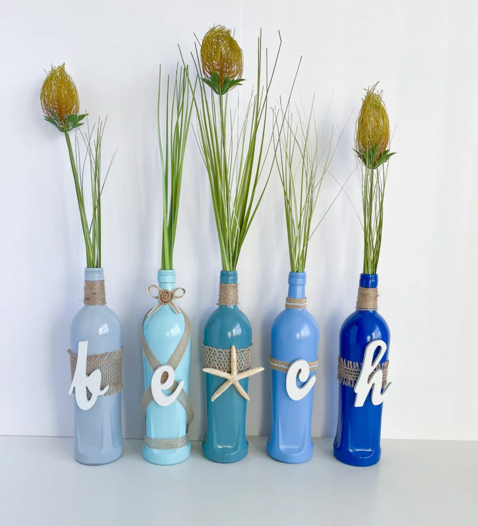 Onion grass in beach glass bottles