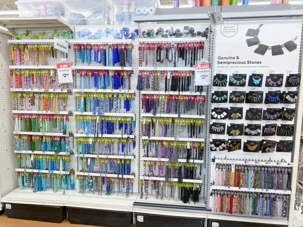 Display of strands of blue and black beads at Michael's craft store
