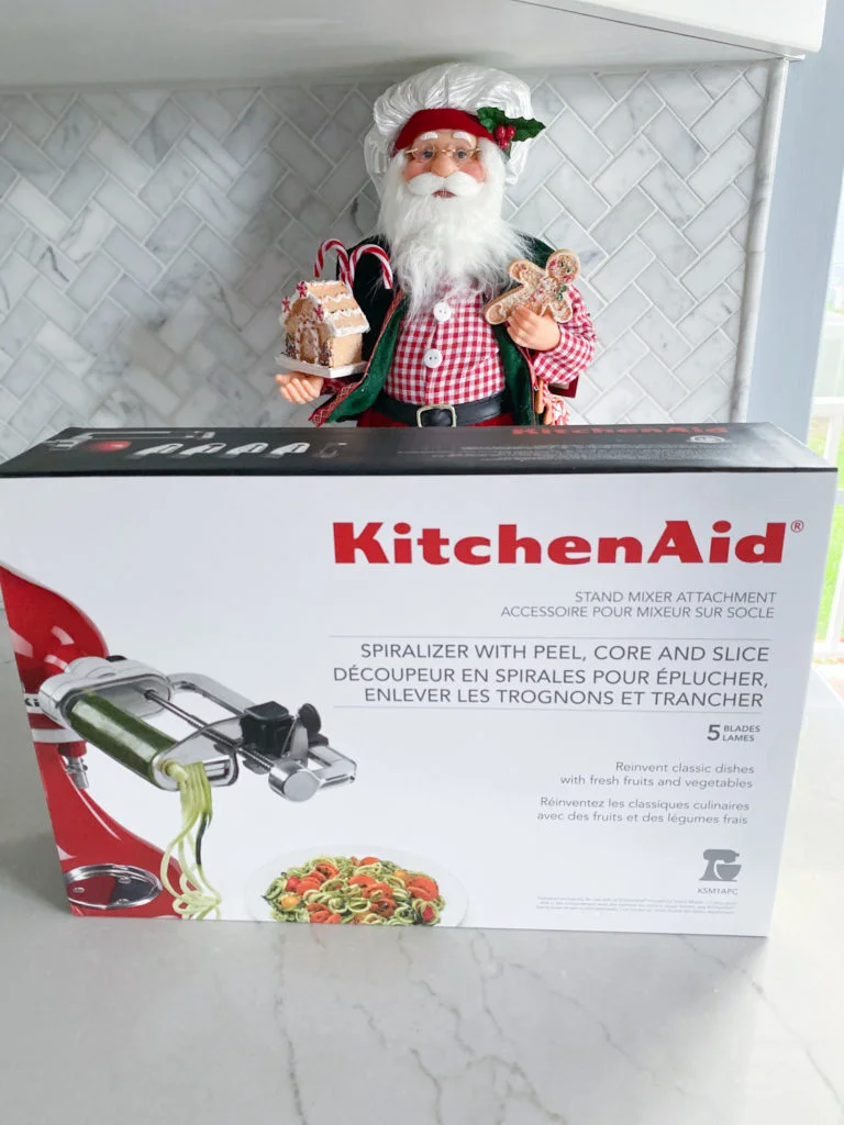Kitchen Aid Spiralizer attachment box in front of baker Santa