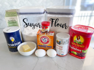 Canisters of flour 7 sugar with buttermilk, salt, baking soda, caraway seeds, baking powder, raisins, butter and eggs