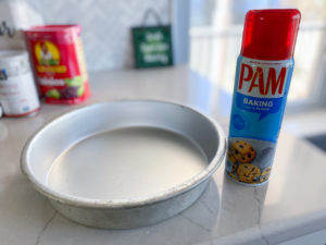 9 inch round pan next to can of Pam baking spray and Sunmaid raisins