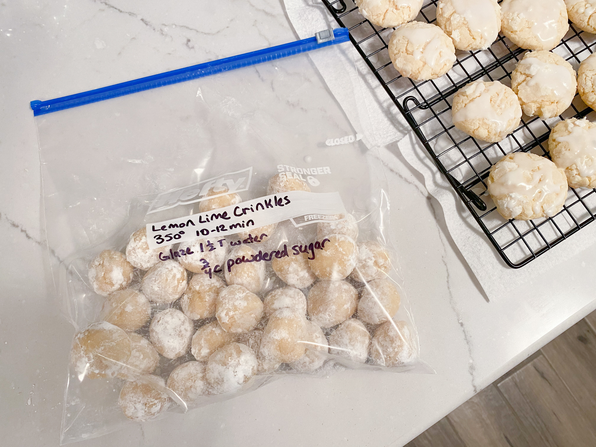 Zippered freezer bag of lemon lime cookie dough balls labeled with 350 degrees 10-12 minutes and Glaze 1 1/2 Tbsp water 3/4 cup powdered sugar