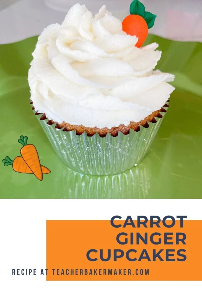 Cupcake in silver liner with ivory buttercream and royal icing carrot on green plate with text overlay of carrot ginger cupcakes with ginger buttercream
