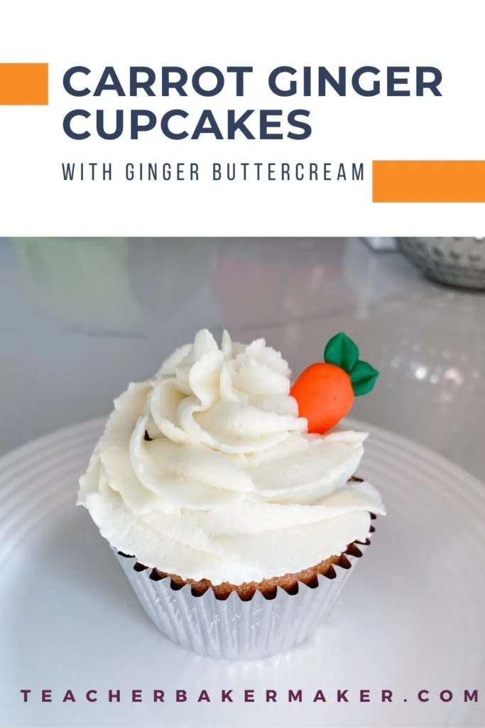 Cupcake in silver liner with white icing and royal icing carrot on a white plate with text overlay of Carrot Ginger Cupcakes with ginger buttercream
