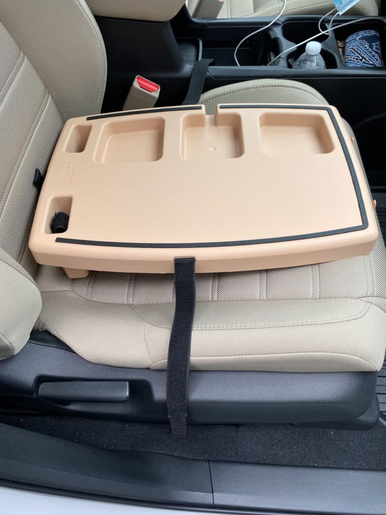 Desert color Stupid Car tray on front seat of Honda CRV with ivory upholstery