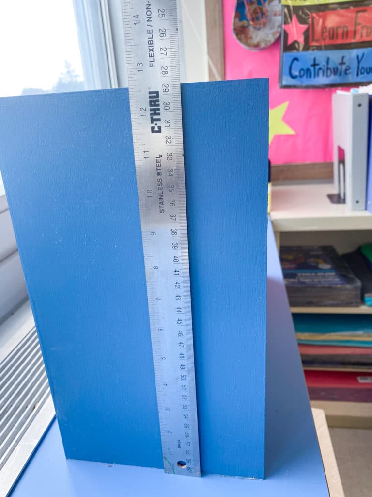 Height of blue painted Ikea Moppe with ruler