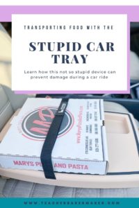 Pizza box on tan car tray Learn how this not so stupid device can prevent damage during a car ride  with text overlay of Transporting food with a Stupid Car Tray and 