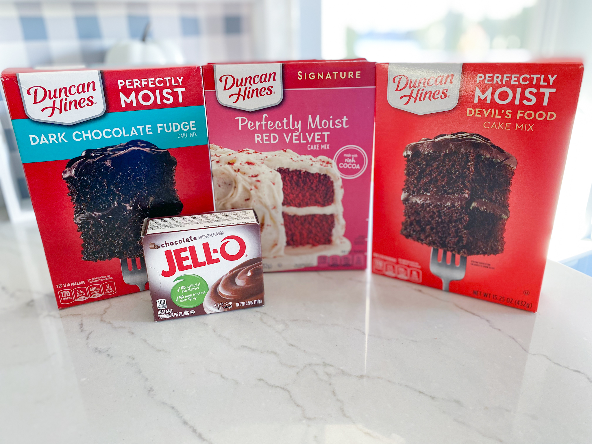 Duncan Hines dark chocolate fudge, red velvet, and devil's food cake mixes with jello instant chocolate pudding