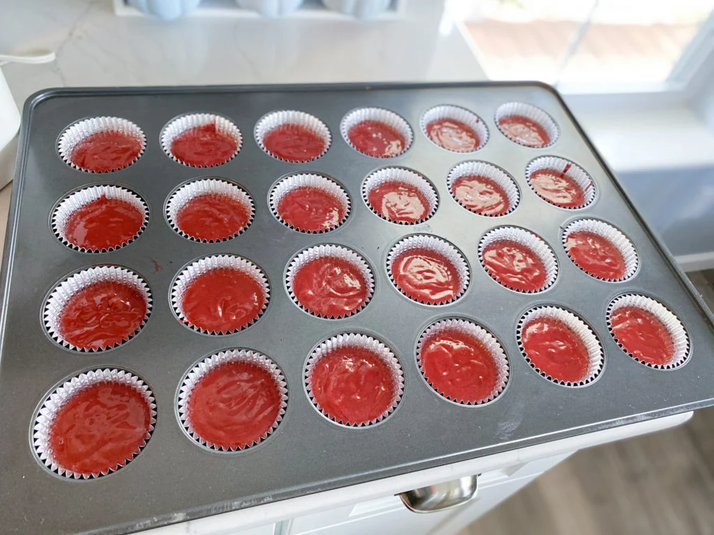 Wilton mega cupcake pan with 24 cupcakes with red velvet sour cream cake batter