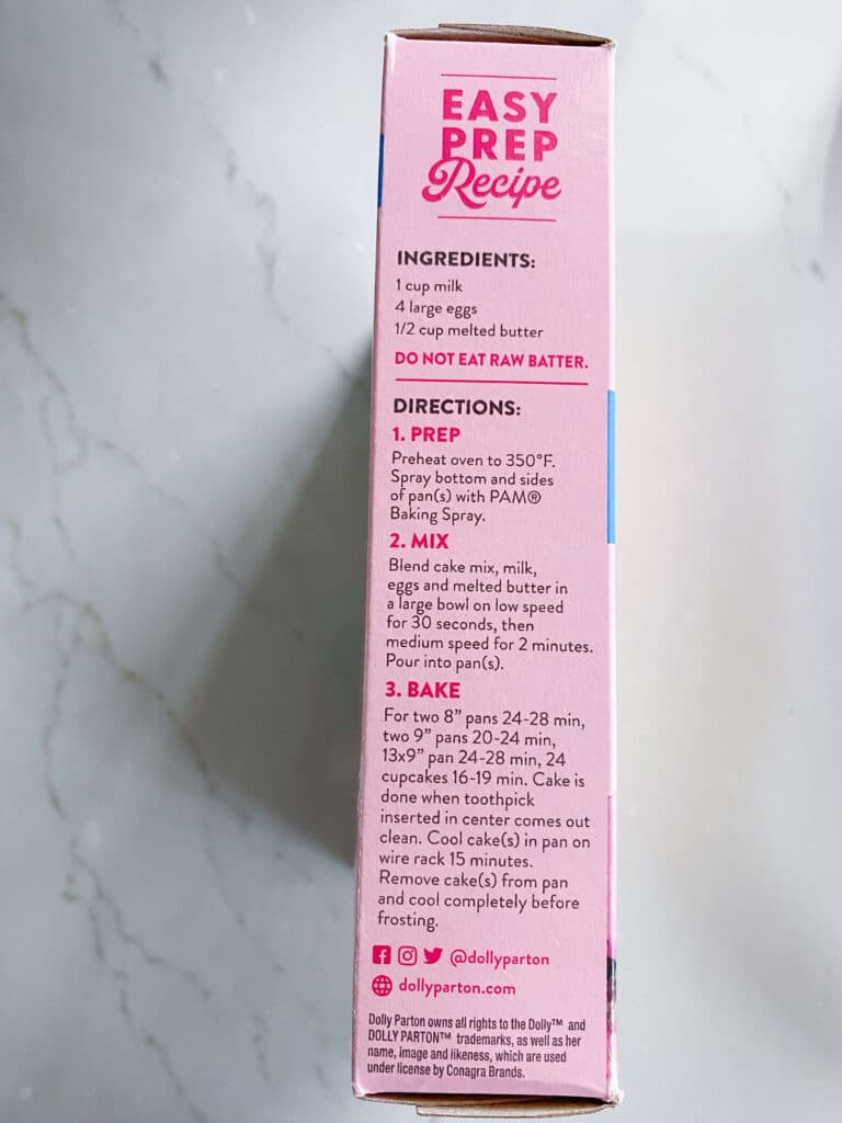 side of package of Dolly Parton coconut cake mix with directions on pink background